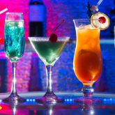 Colourful tiki cocktails at The Sugar Cane, a tropical cocktail bar near Clapham Junction Station in London